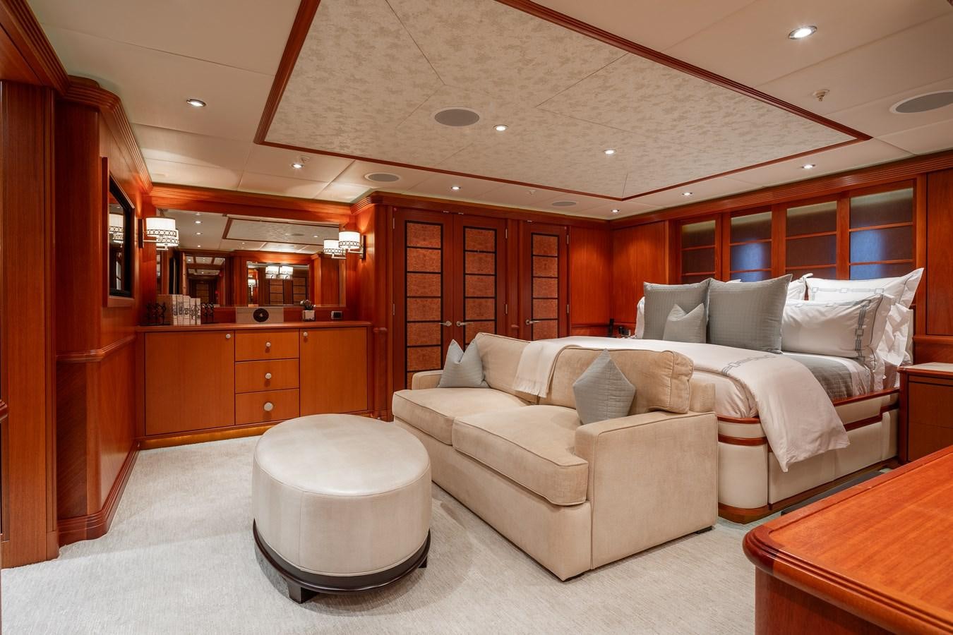 a living room with a couch and a table aboard SKYFALL Yacht for Sale