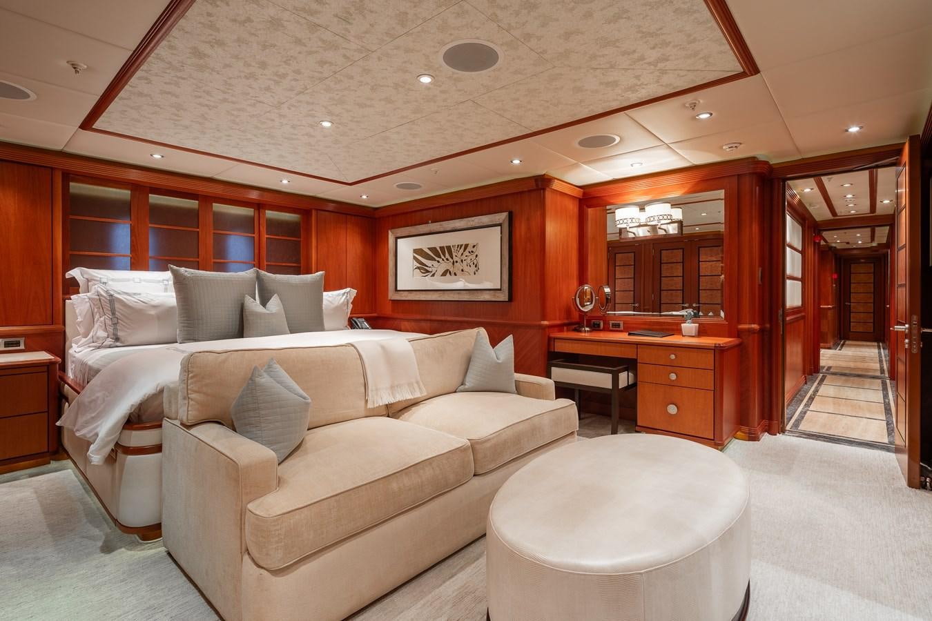 a living room with a couch and a table aboard SKYFALL Yacht for Sale