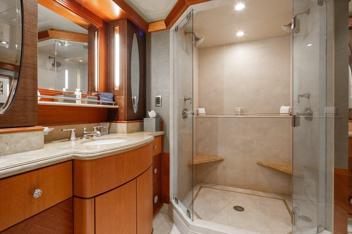 a bathroom with a glass shower aboard SKYFALL Yacht for Sale