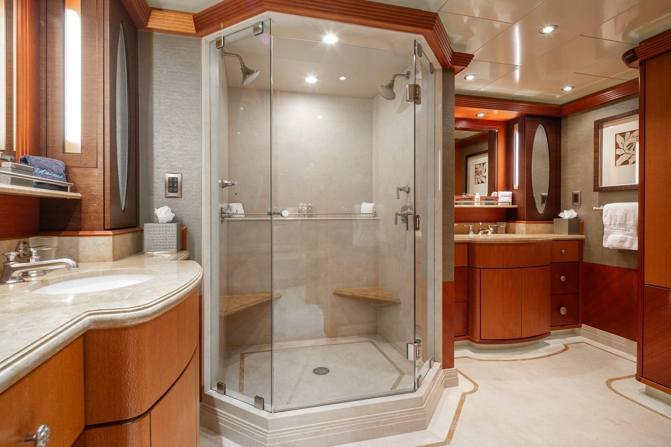 a bathroom with a glass shower aboard SKYFALL Yacht for Sale