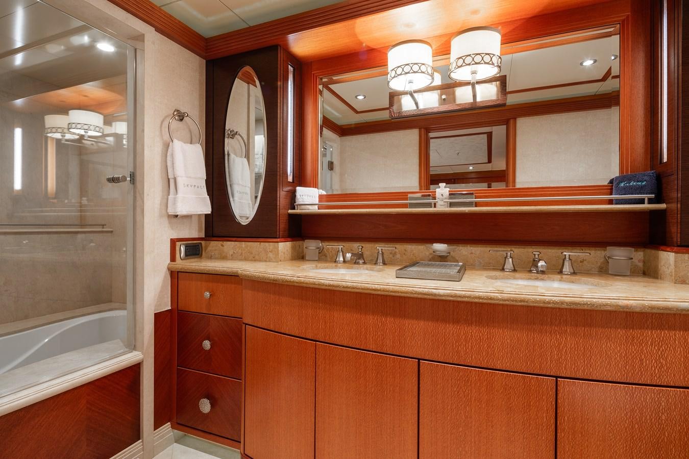 a bathroom with a sink and a mirror aboard SKYFALL Yacht for Sale