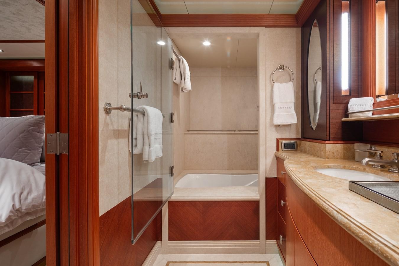 a bathroom with a glass shower aboard SKYFALL Yacht for Sale