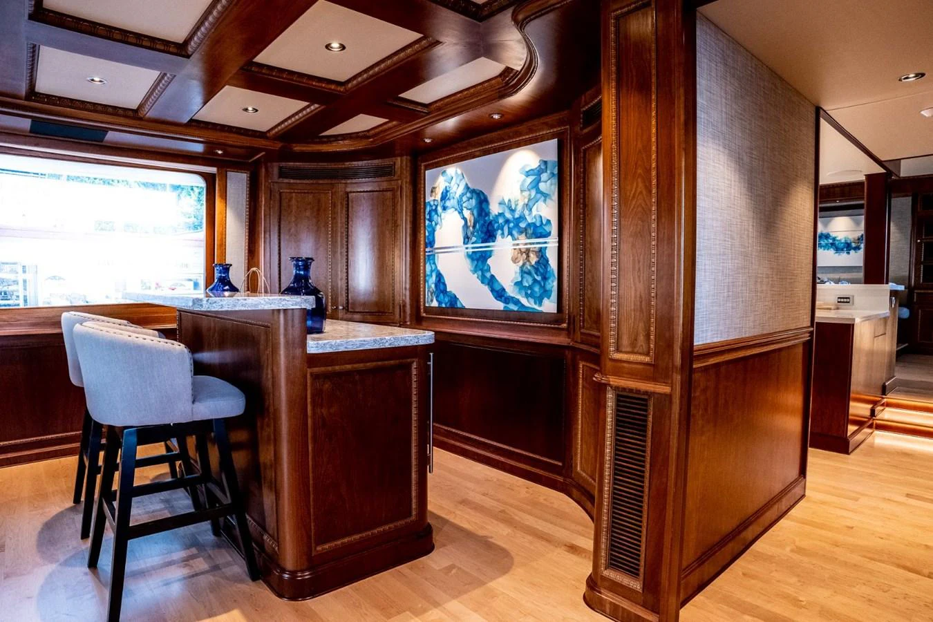 a room with a desk and a window aboard DOZER Yacht for Sale