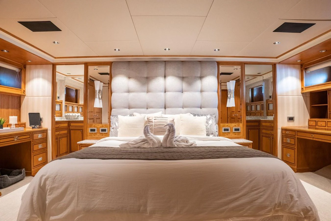 a bed with a black and white bed spread aboard DOZER Yacht for Sale