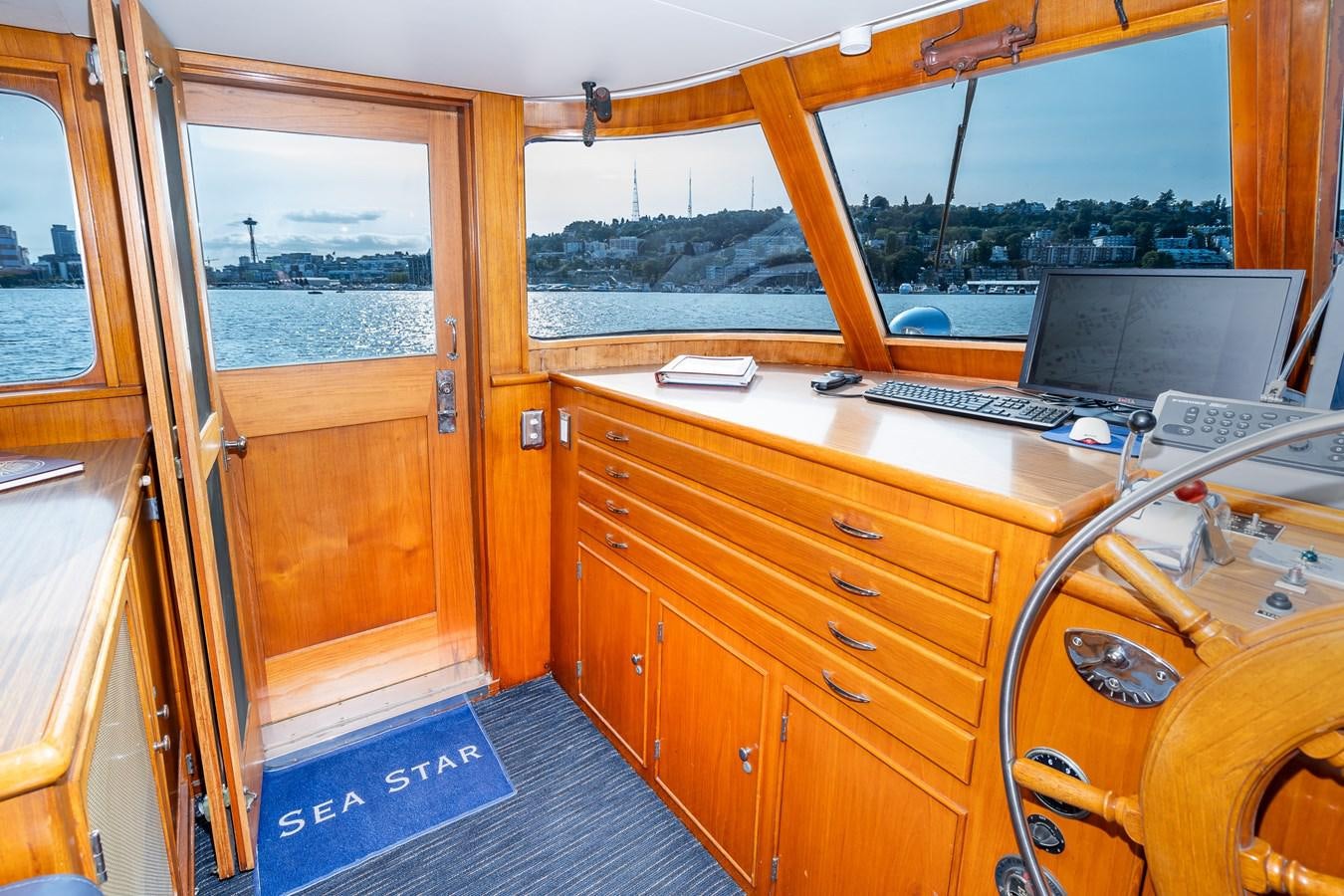 a room with a laptop and a piano aboard SEA STAR Yacht for Sale