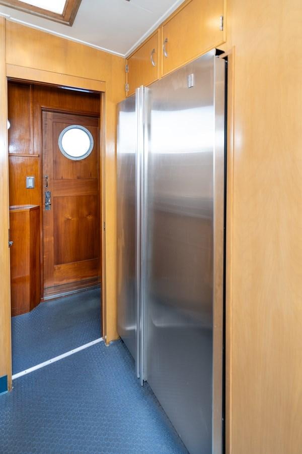 a room with wooden cabinets aboard SEA STAR Yacht for Sale