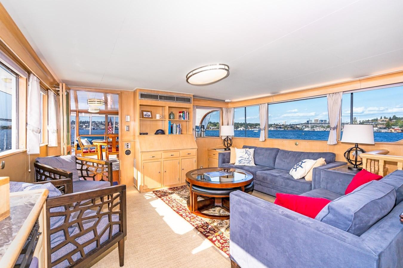 a living room with a couch and a table aboard SEA STAR Yacht for Sale