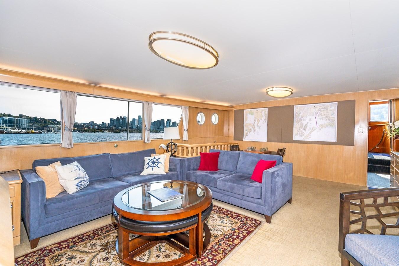 a living room with a couch and a coffee table aboard SEA STAR Yacht for Sale