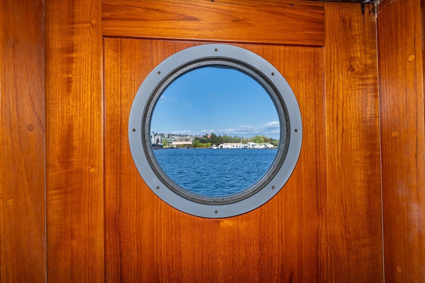 a window with a view of the water aboard SEA STAR Yacht for Sale