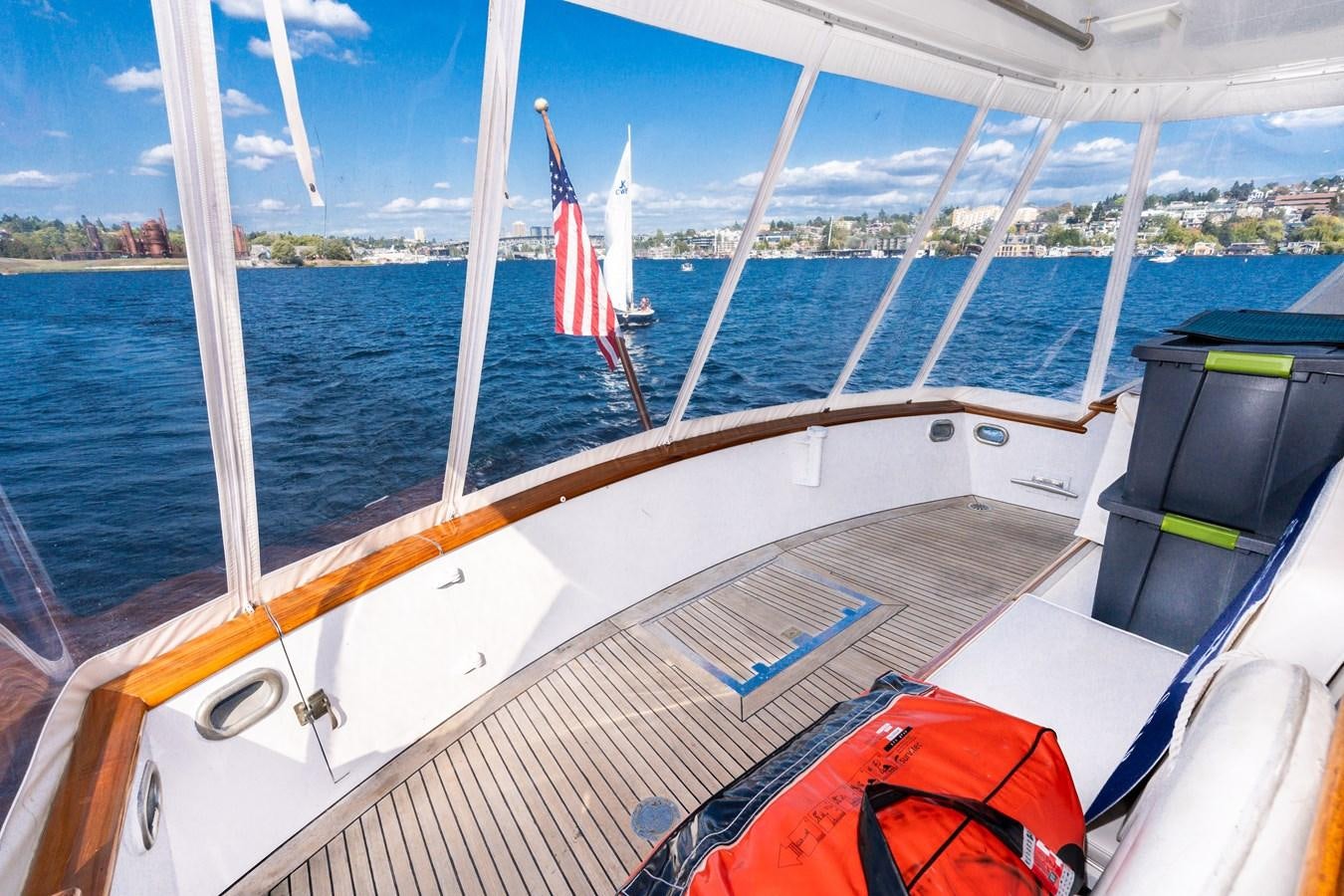 a boat with a flag on the front aboard SEA STAR Yacht for Sale