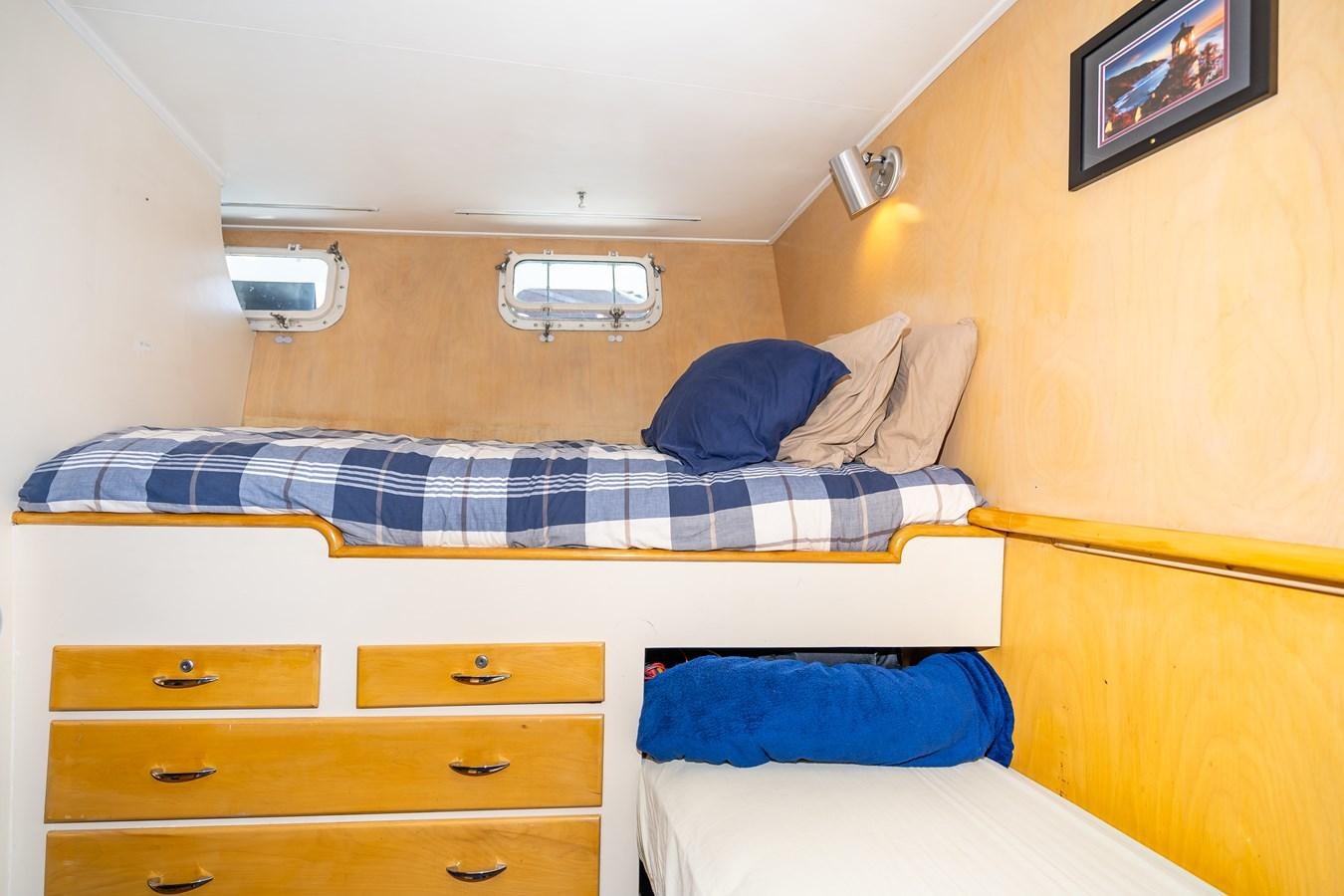 a couple of beds in a room aboard SEA STAR Yacht for Sale