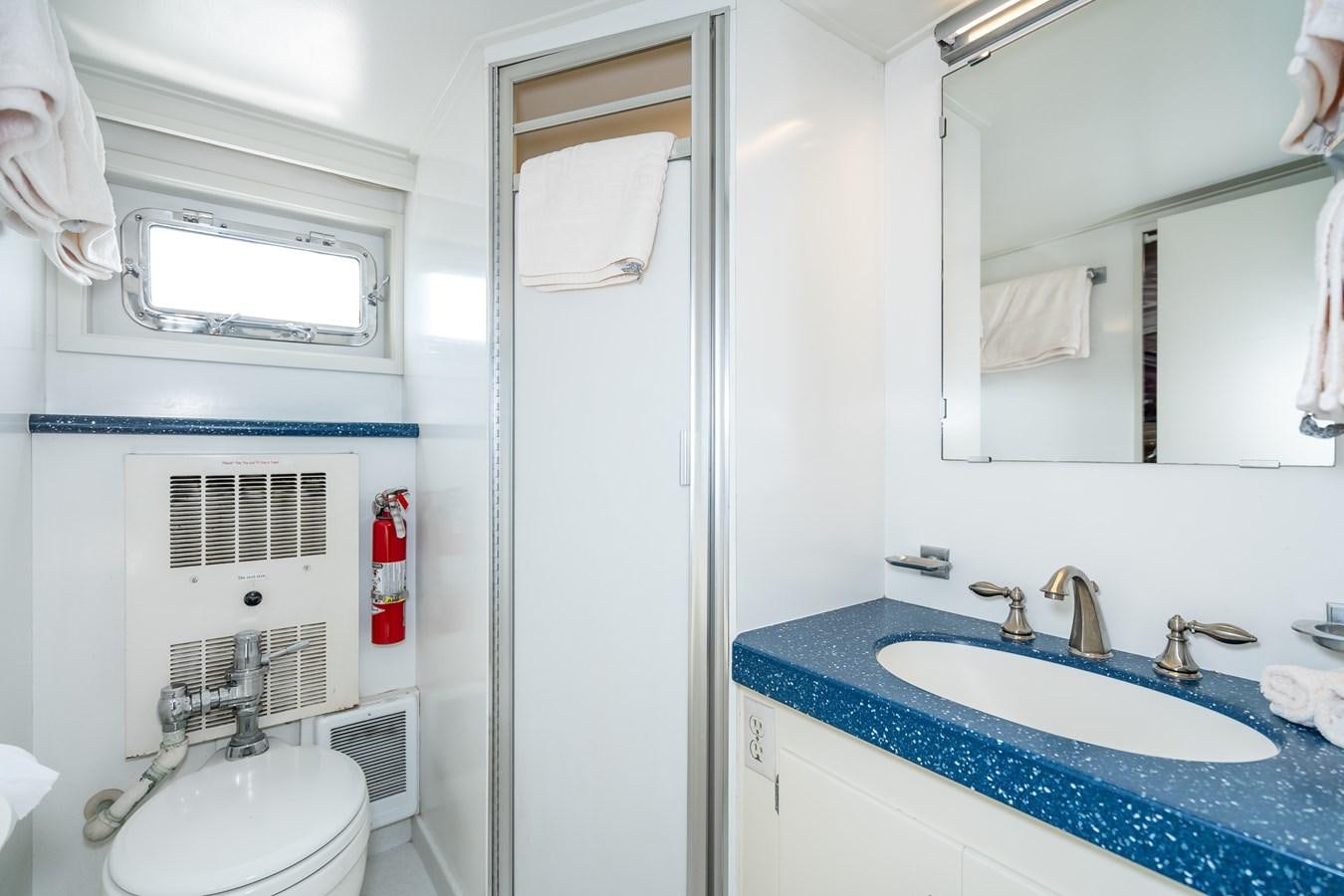 a bathroom with a sink and a toilet aboard SEA STAR Yacht for Sale