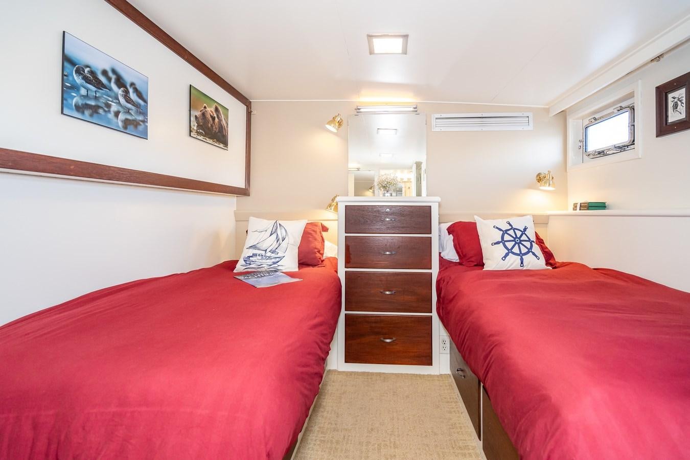 a room with two beds aboard SEA STAR Yacht for Sale