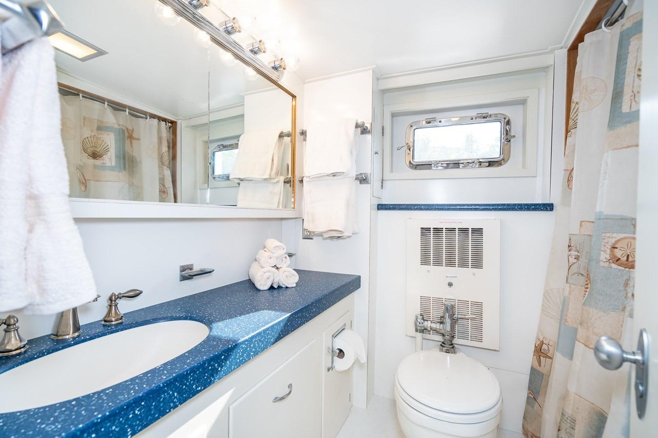 a bathroom with a sink and toilet aboard SEA STAR Yacht for Sale