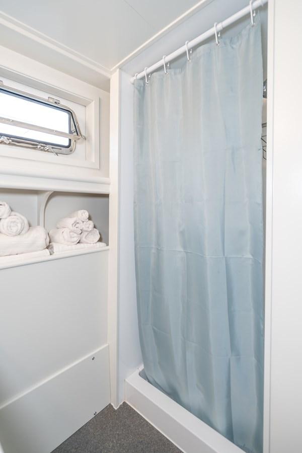 a shower curtain in a bathroom aboard SEA STAR Yacht for Sale