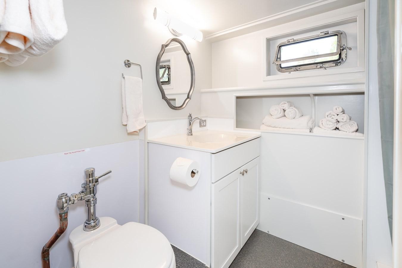 a bathroom with a sink and toilet aboard SEA STAR Yacht for Sale