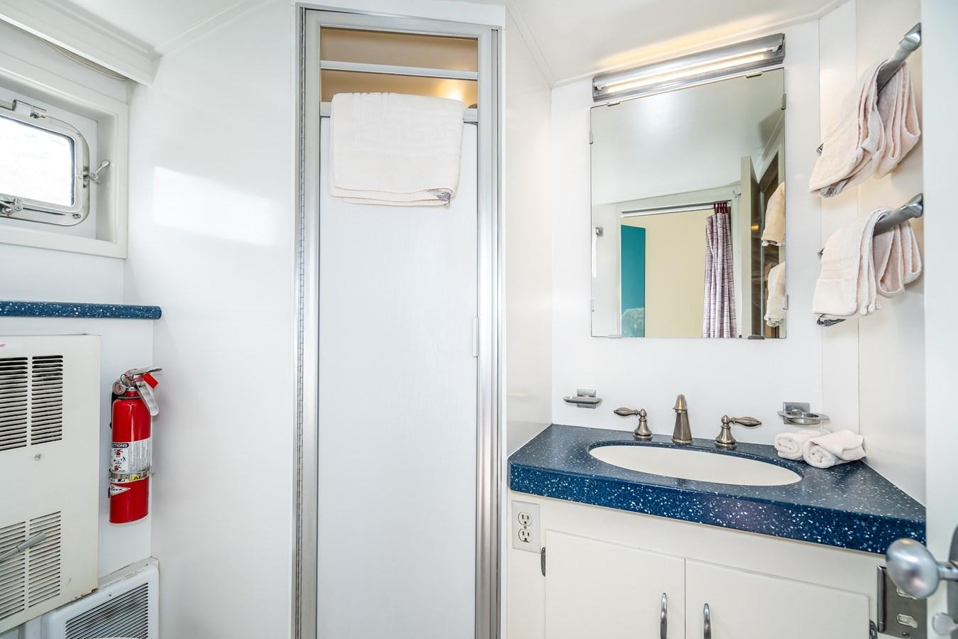 a bathroom with a sink and a mirror aboard SEA STAR Yacht for Sale