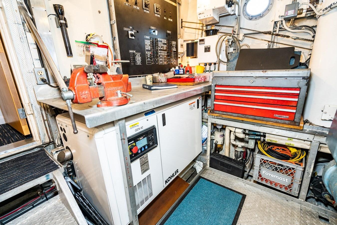 a room with a machine and tools aboard SEA STAR Yacht for Sale