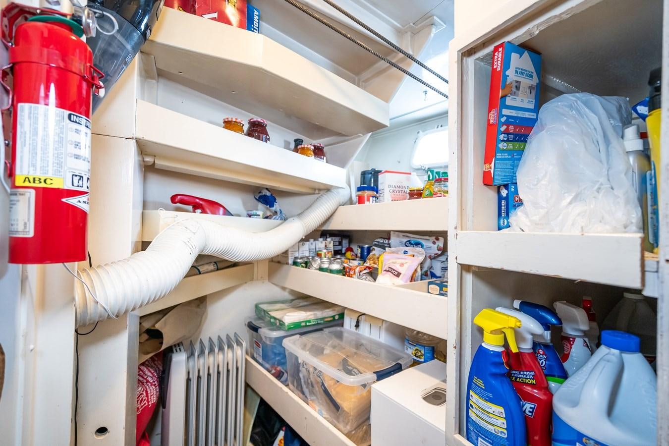 a shelf with a variety of items aboard SEA STAR Yacht for Sale
