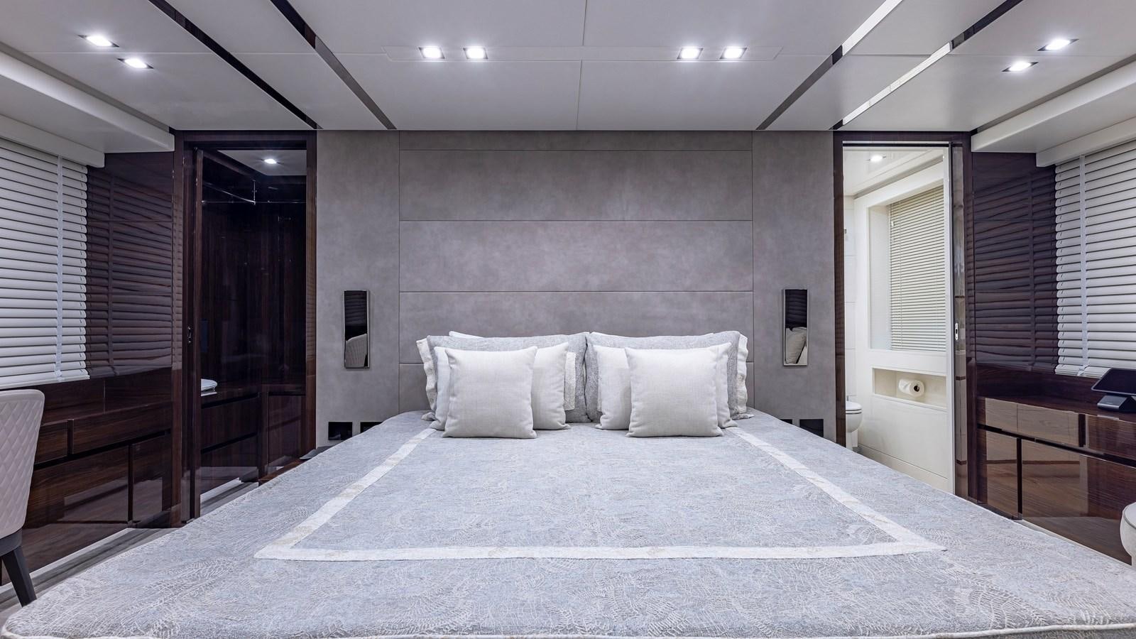 a large bed in a hotel room aboard INCENTIVIZED Yacht for Sale