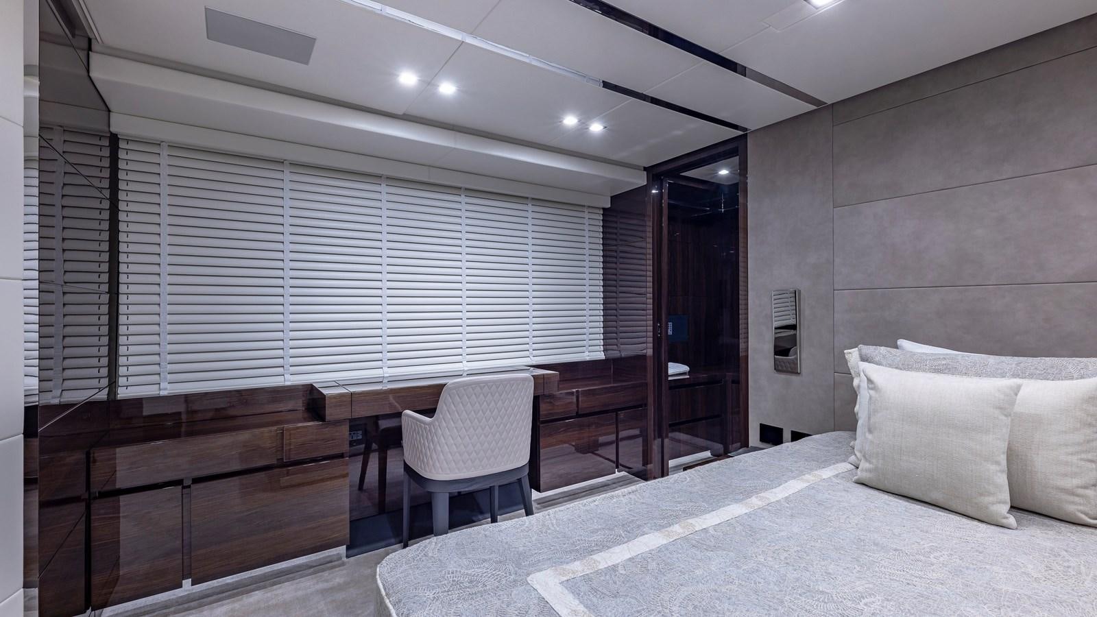 a room with a bed and a desk aboard INCENTIVIZED Yacht for Sale