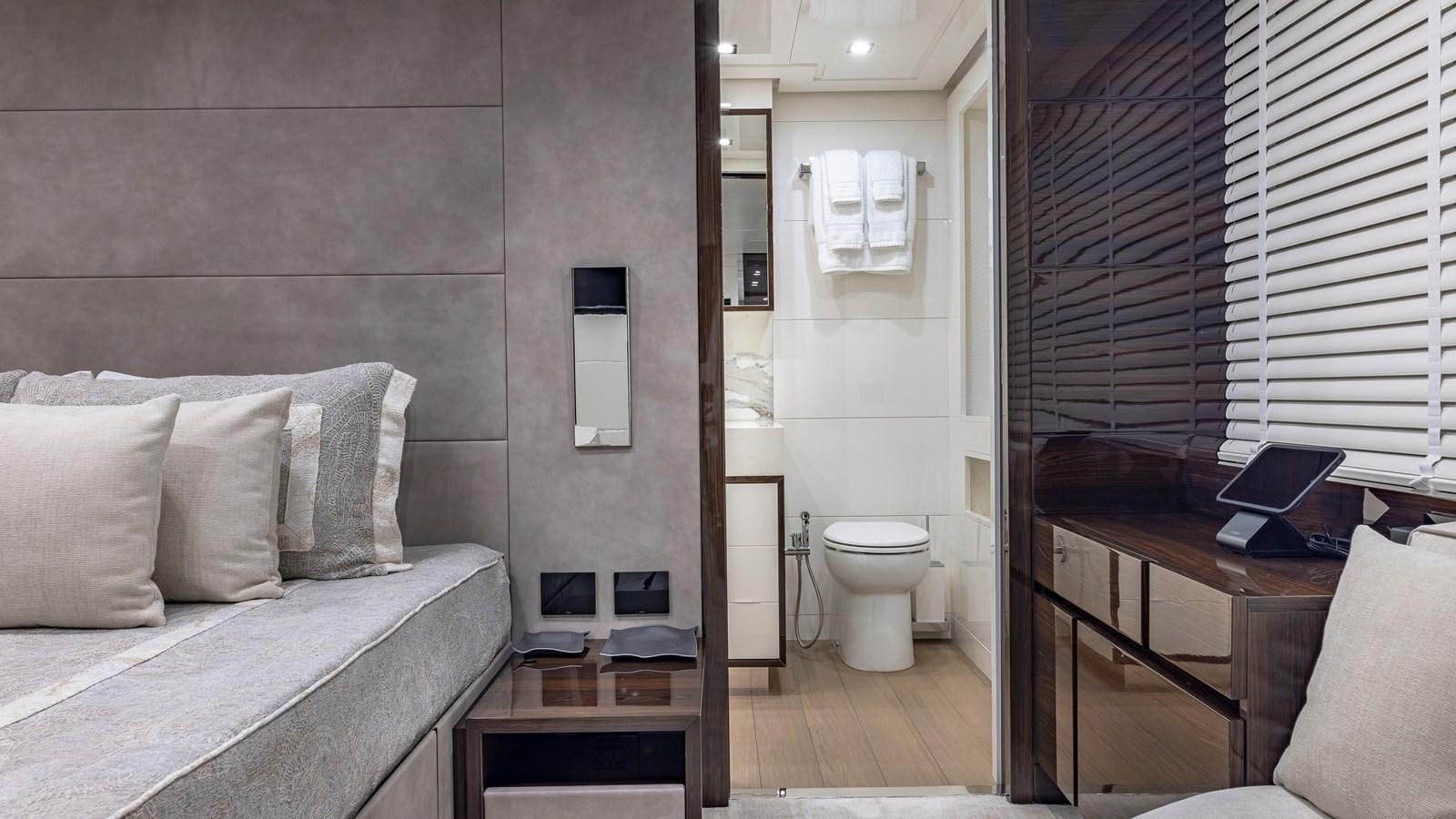 a room with a bed and a desk aboard INCENTIVIZED Yacht for Sale