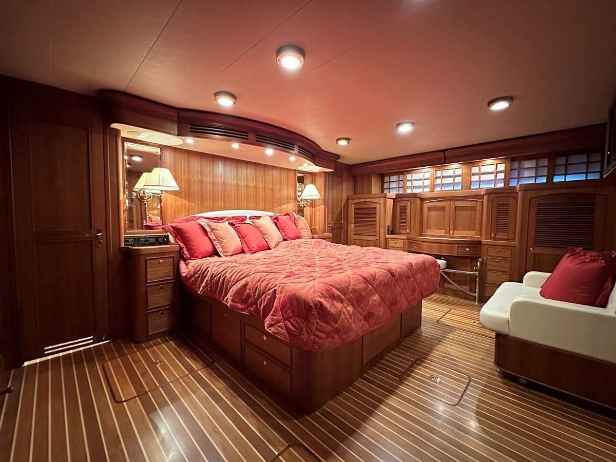 a large bedroom with a large bed aboard AZURA Yacht for Sale