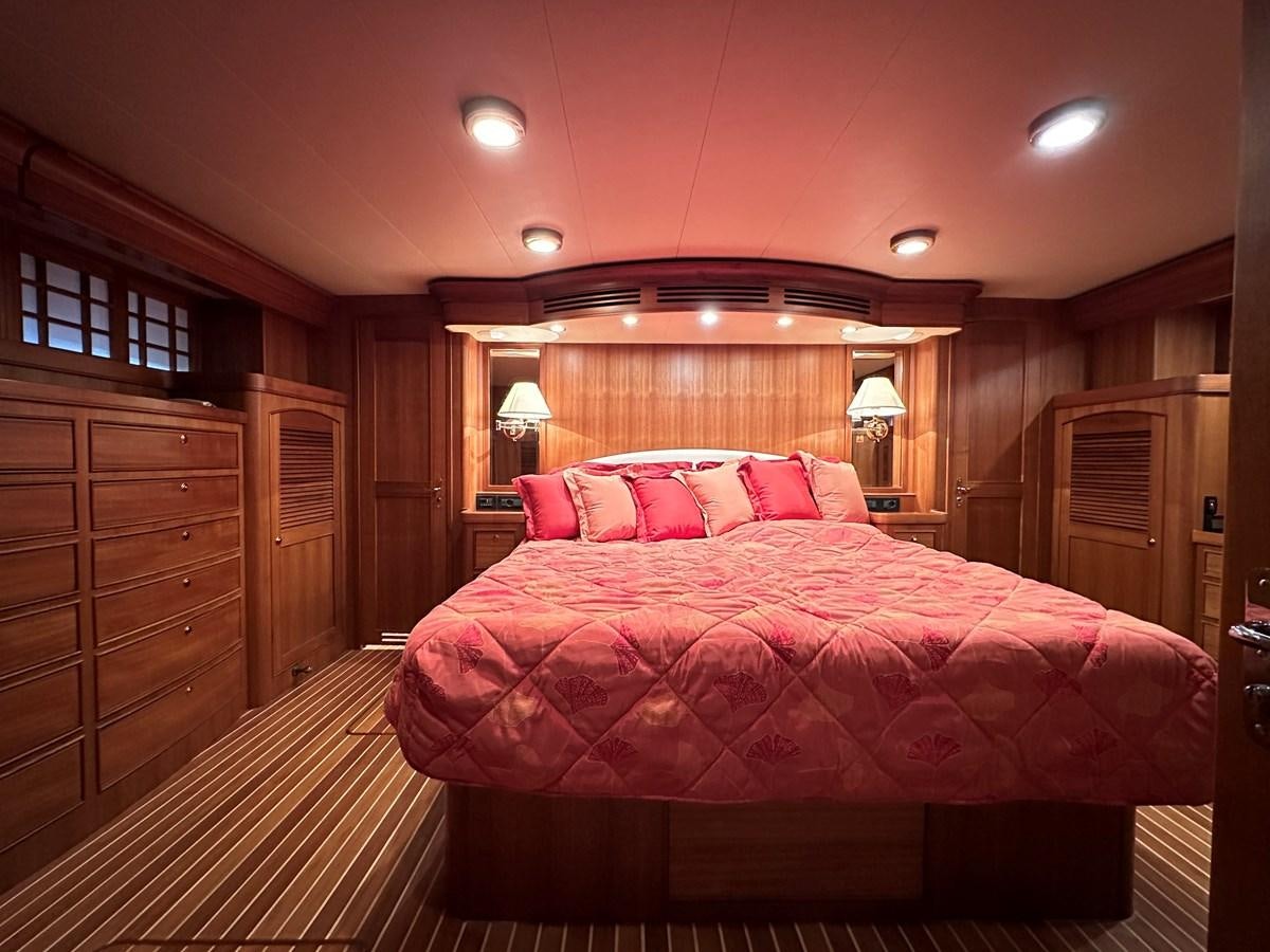 a bed in a room aboard AZURA Yacht for Sale
