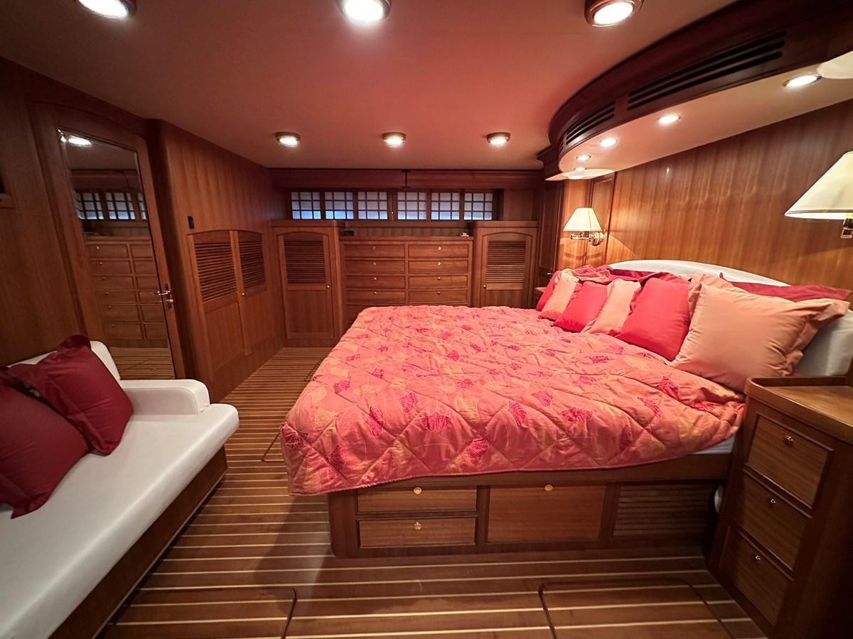a large bed in a hotel room aboard AZURA Yacht for Sale