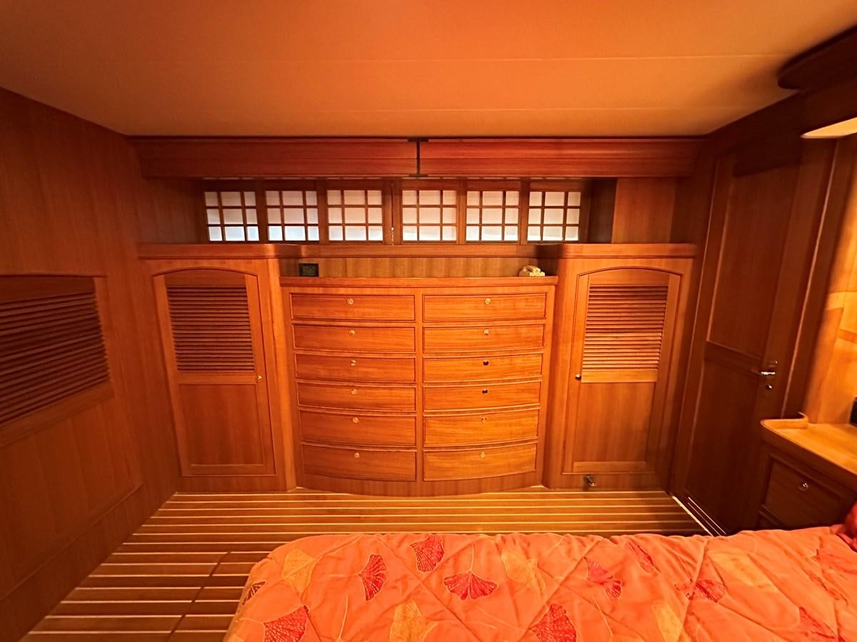 a room with wooden cabinets aboard AZURA Yacht for Sale