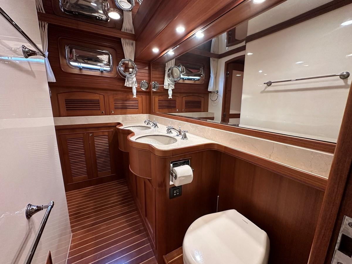 a bathroom with a sink and a toilet aboard AZURA Yacht for Sale
