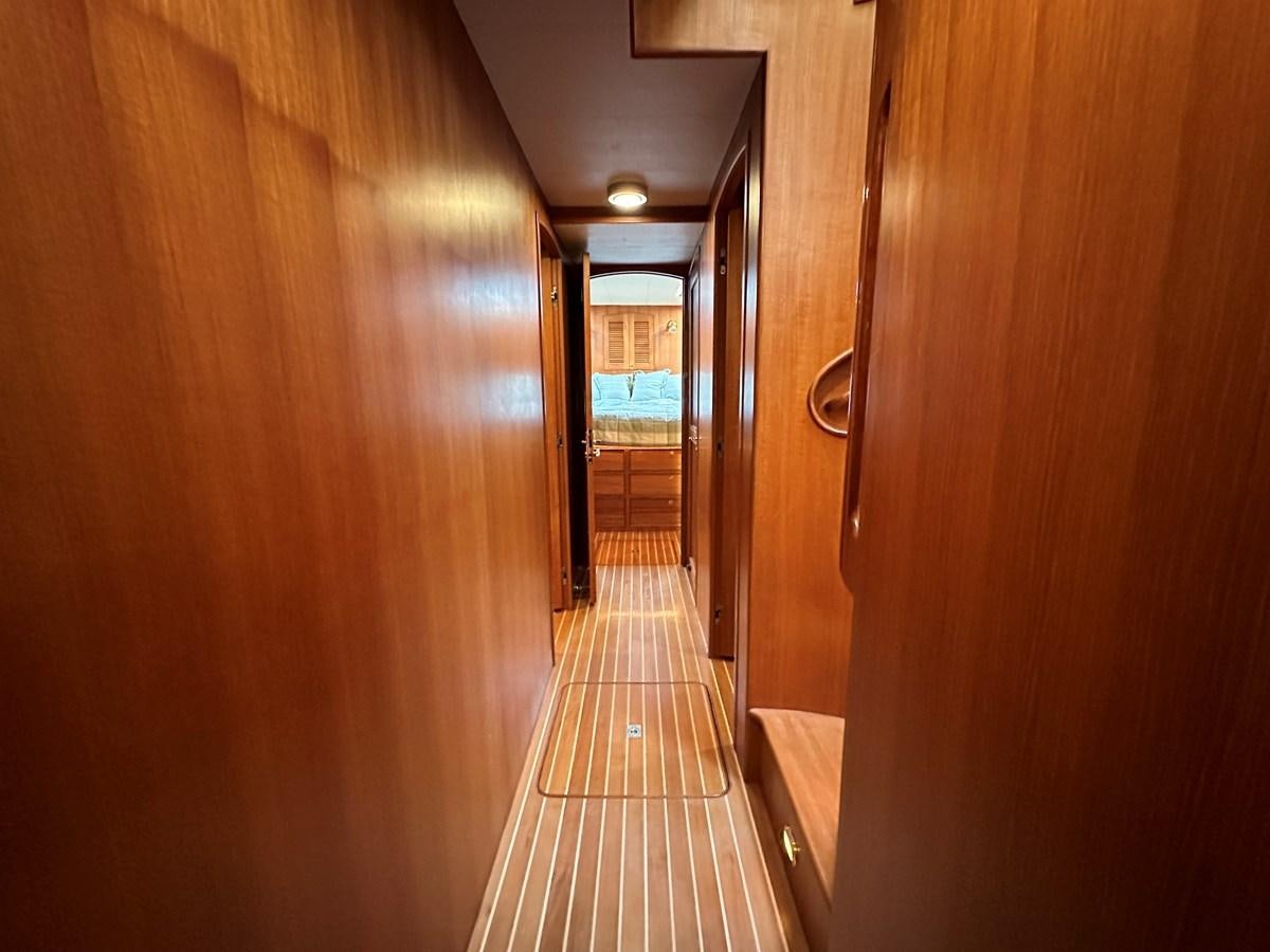 a hallway with a tile floor aboard AZURA Yacht for Sale