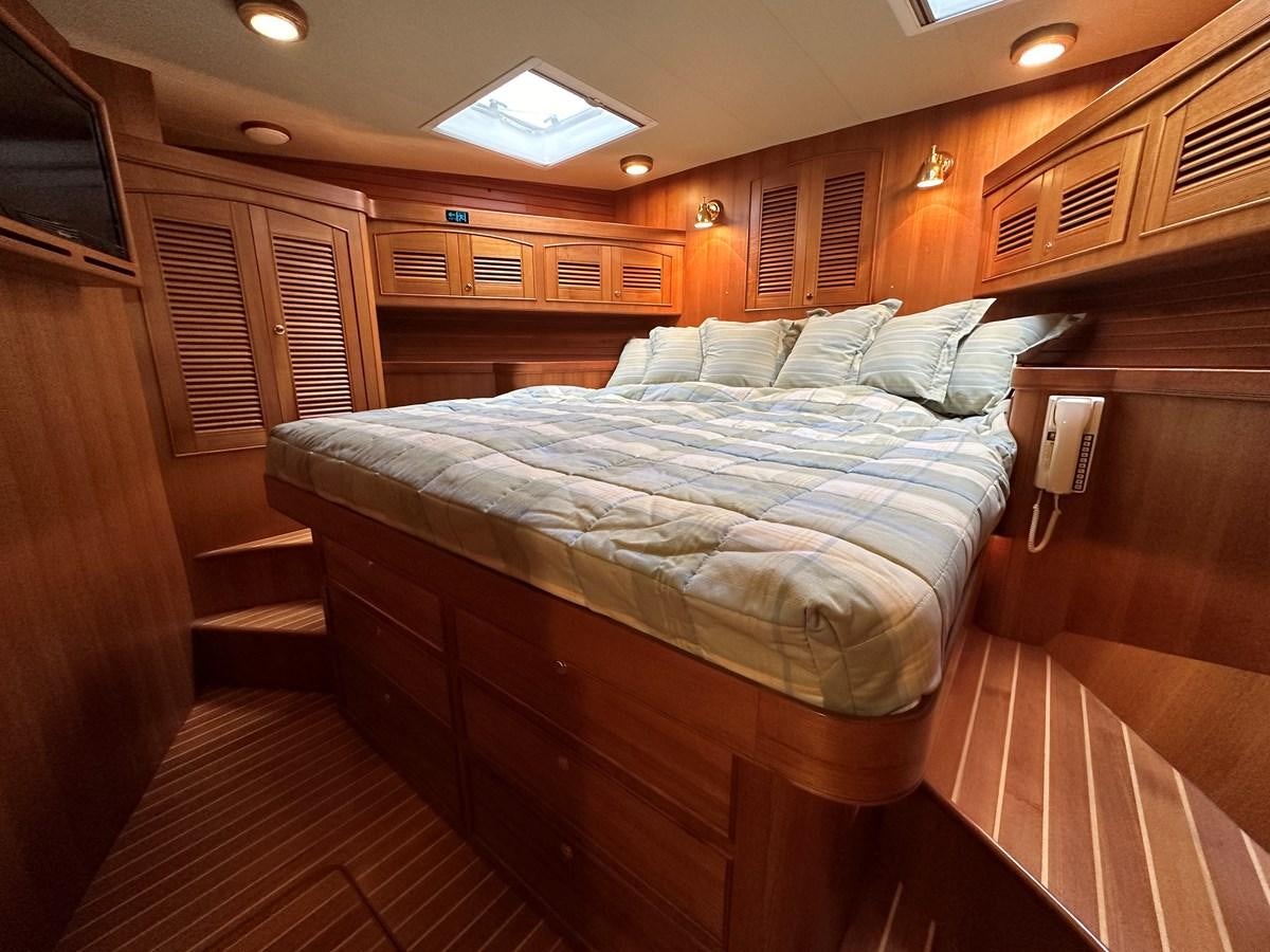 a bed in a cabin aboard AZURA Yacht for Sale