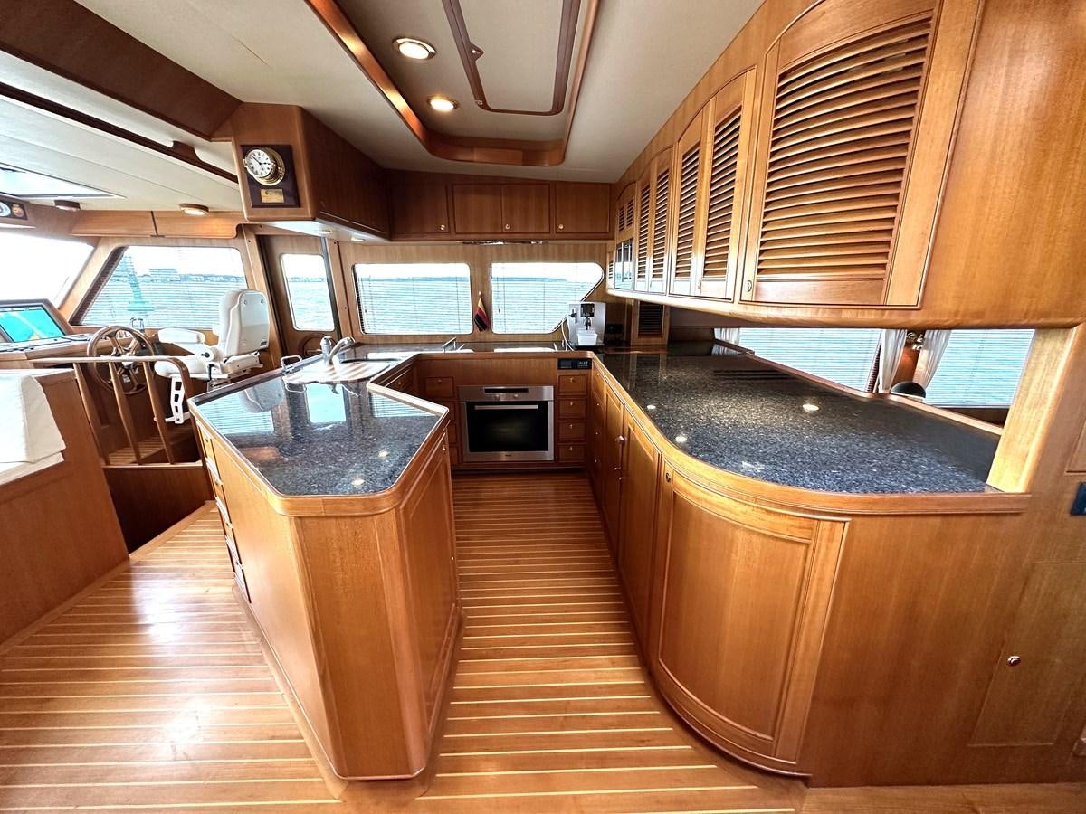 a kitchen with a large island aboard AZURA Yacht for Sale