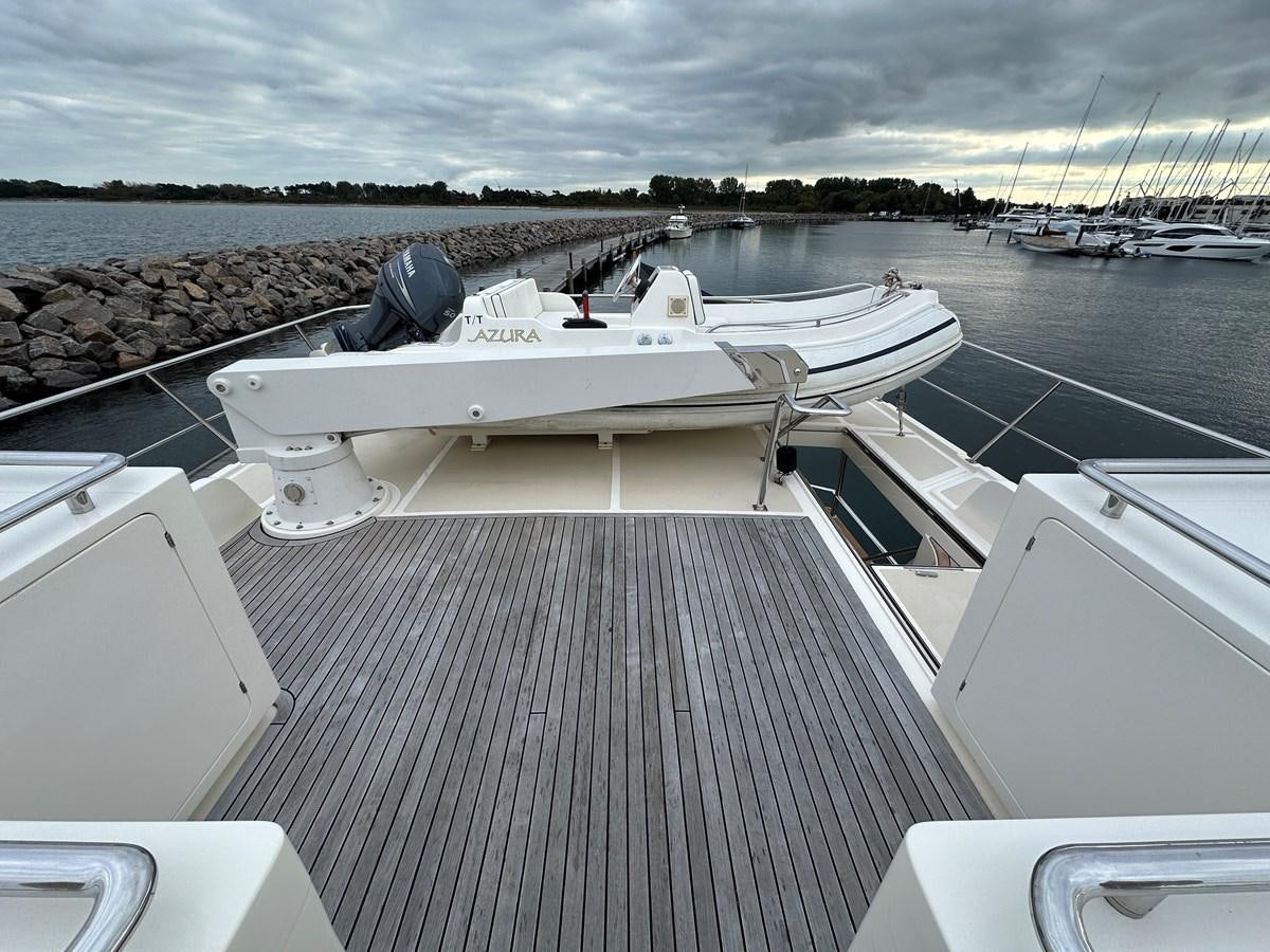 a boat on a dock aboard AZURA Yacht for Sale