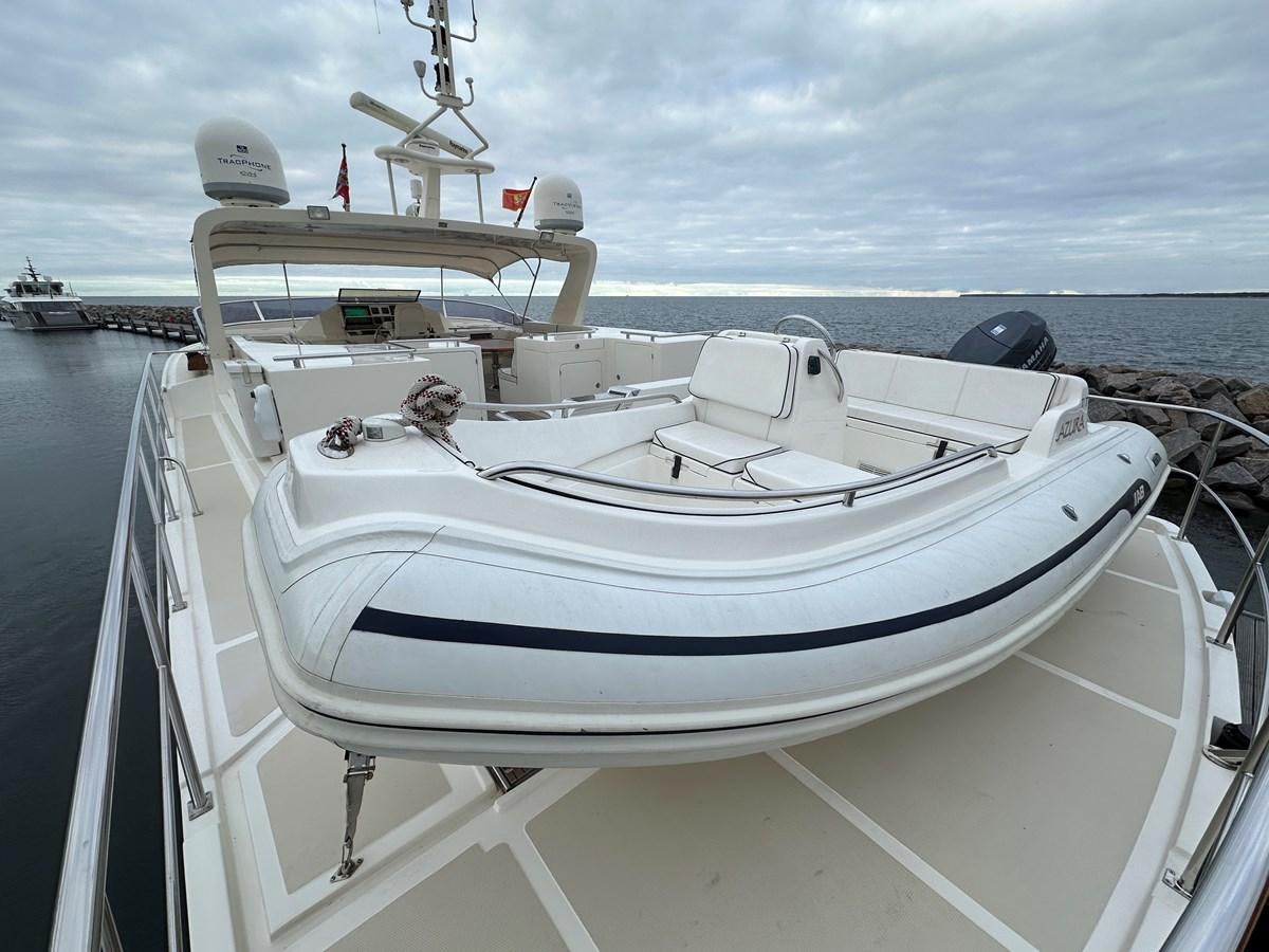 a white boat on the water aboard AZURA Yacht for Sale