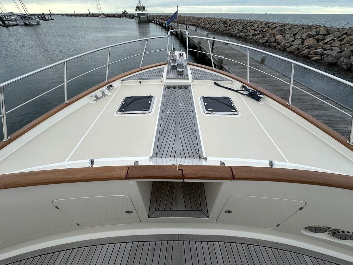 a large white building with a large deck and a large body of water aboard AZURA Yacht for Sale