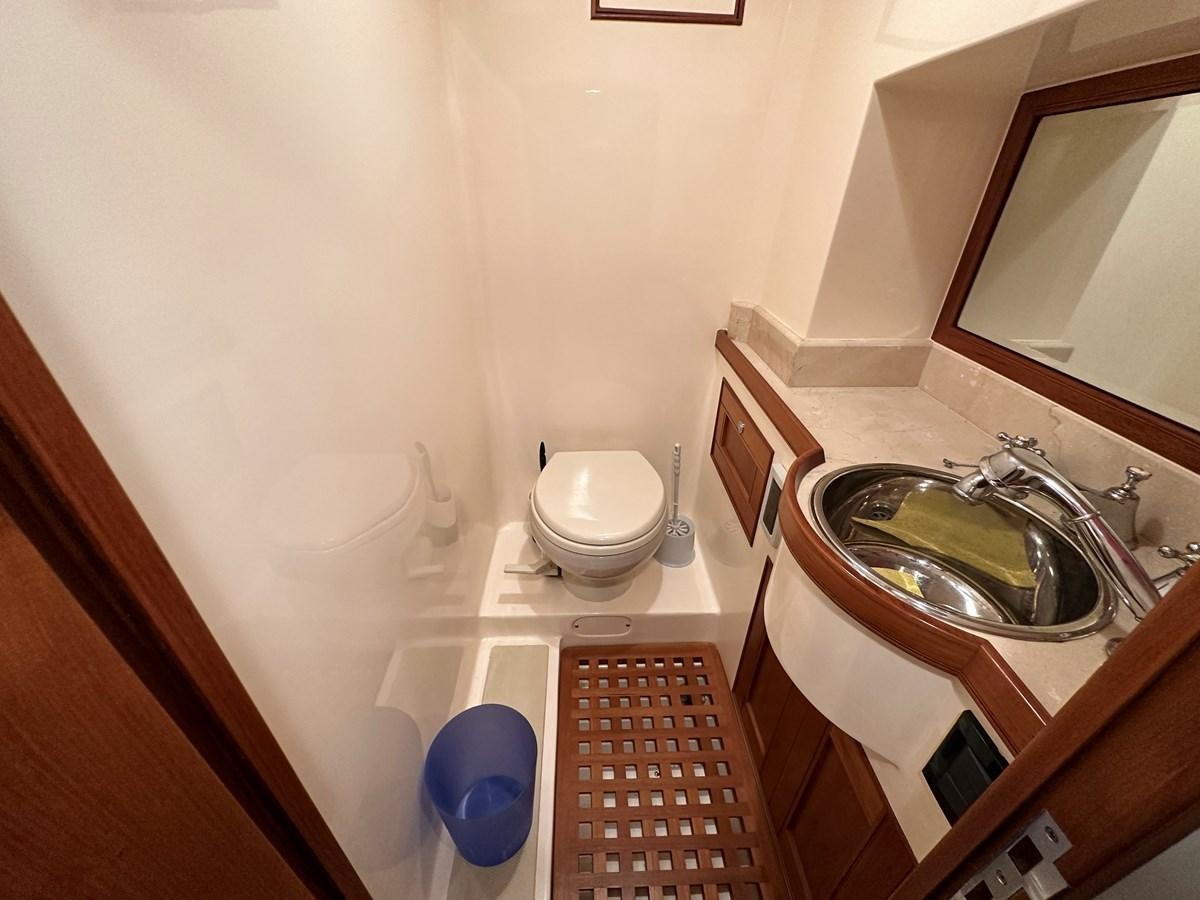 a bathroom with a sink and toilet aboard AZURA Yacht for Sale