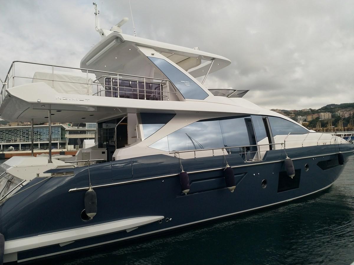 a boat docked at a pier aboard BLUE Yacht for Sale