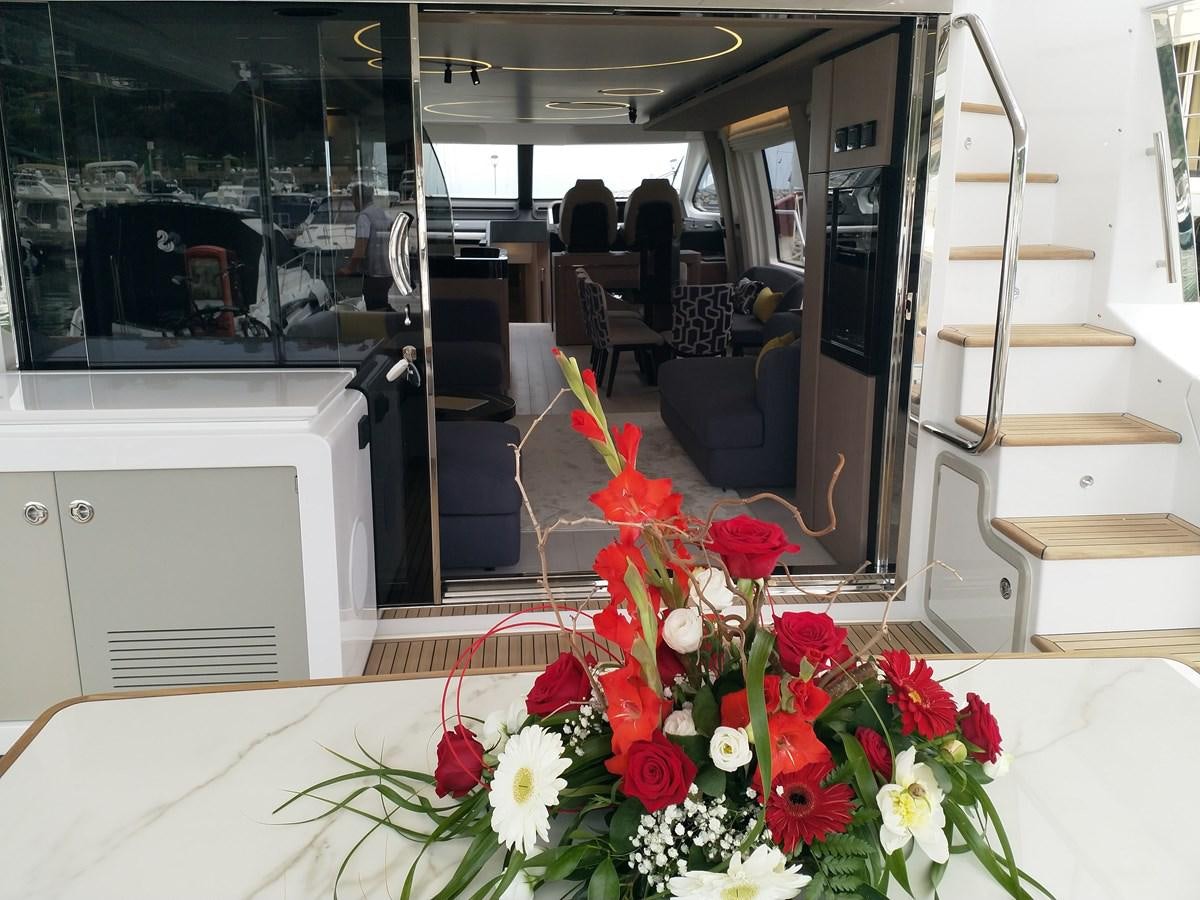 a room with chairs and tables aboard BLUE Yacht for Sale