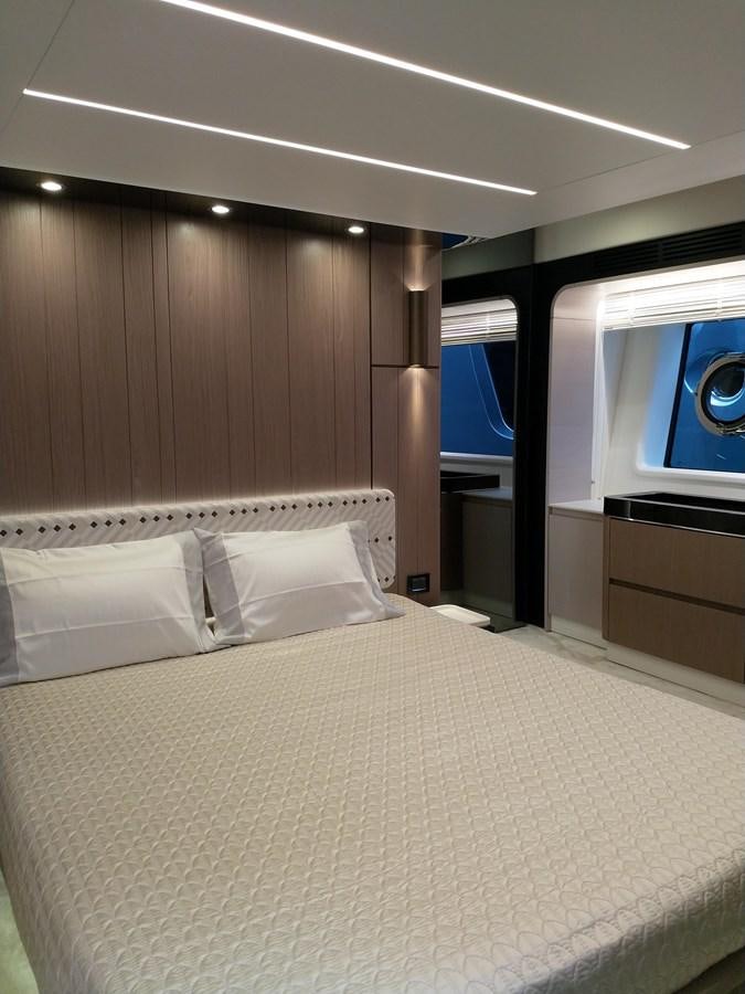 a bed with white sheets aboard BLUE Yacht for Sale
