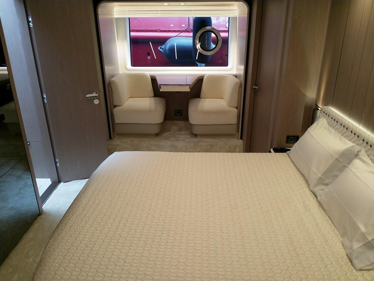 a room with a bed and a television aboard BLUE Yacht for Sale
