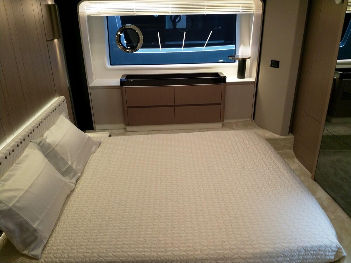 a room with a bed and a television aboard BLUE Yacht for Sale