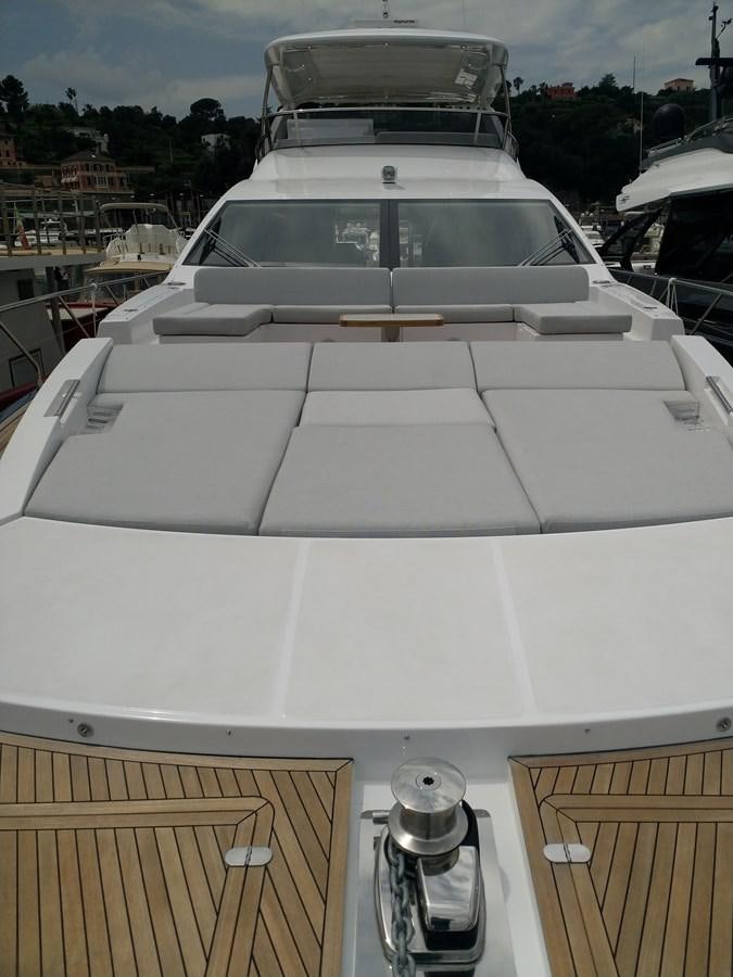 a white car with a white roof aboard BLUE Yacht for Sale