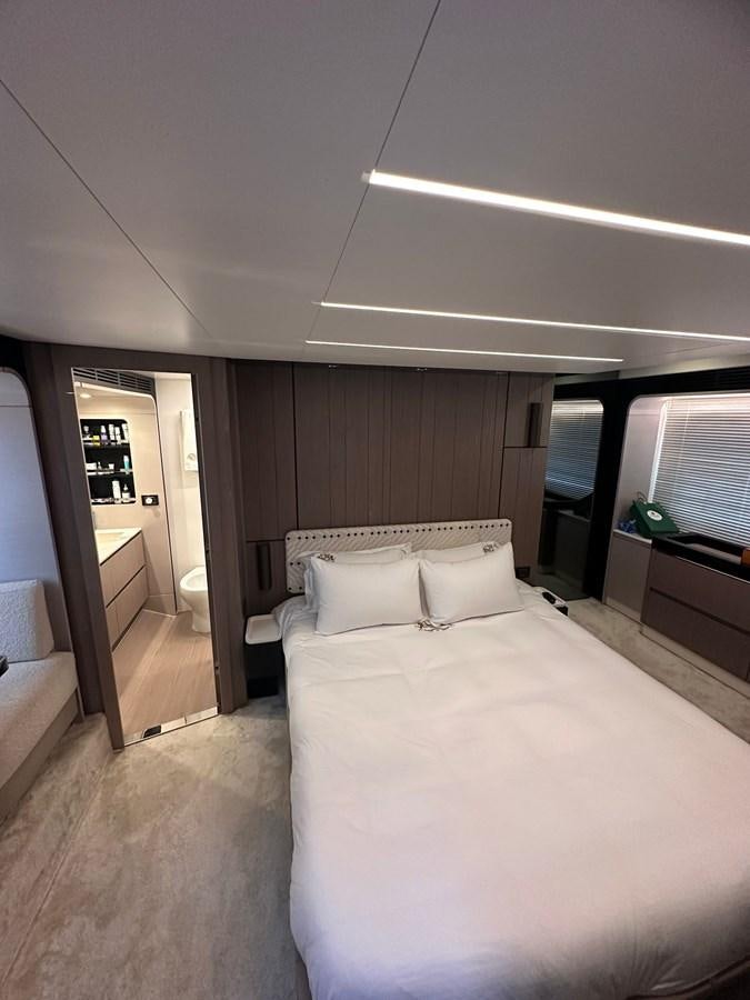 a bedroom with a bed and a door aboard BLUE Yacht for Sale