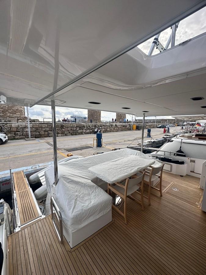 a room with tables and chairs aboard BLUE Yacht for Sale