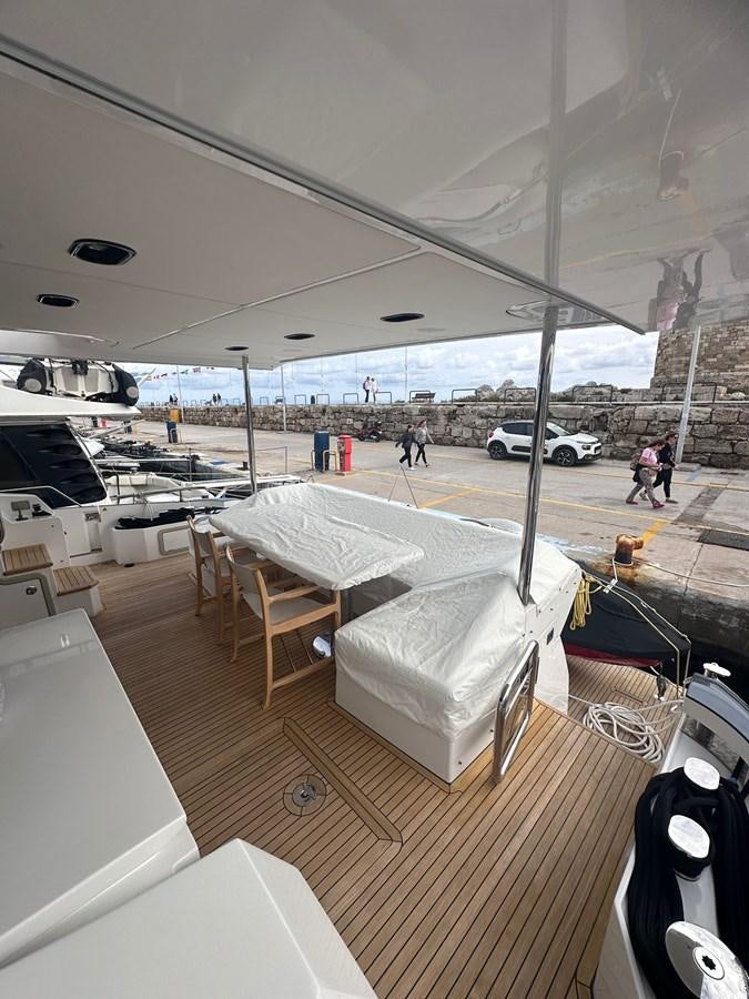 a room with a table and chairs aboard BLUE Yacht for Sale