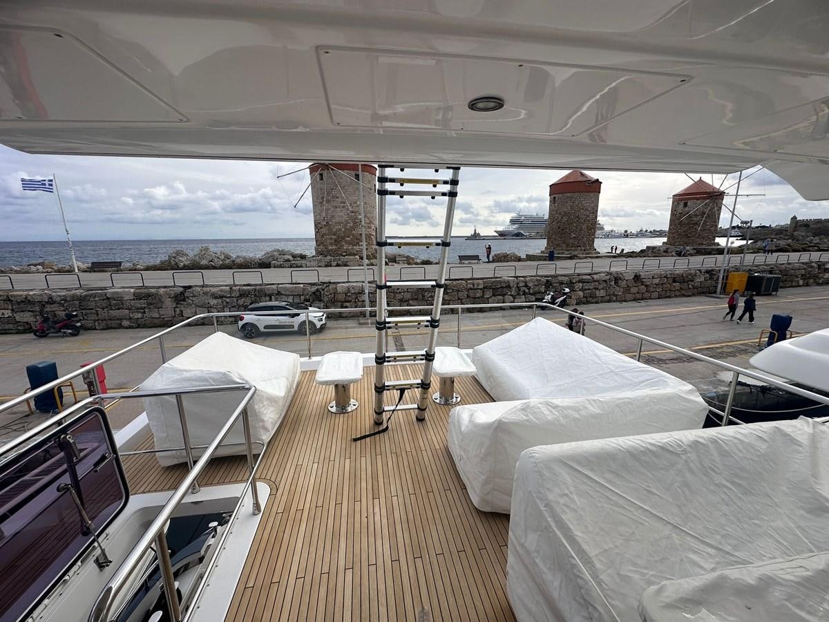 a deck with a view of a city and a large building aboard BLUE Yacht for Sale