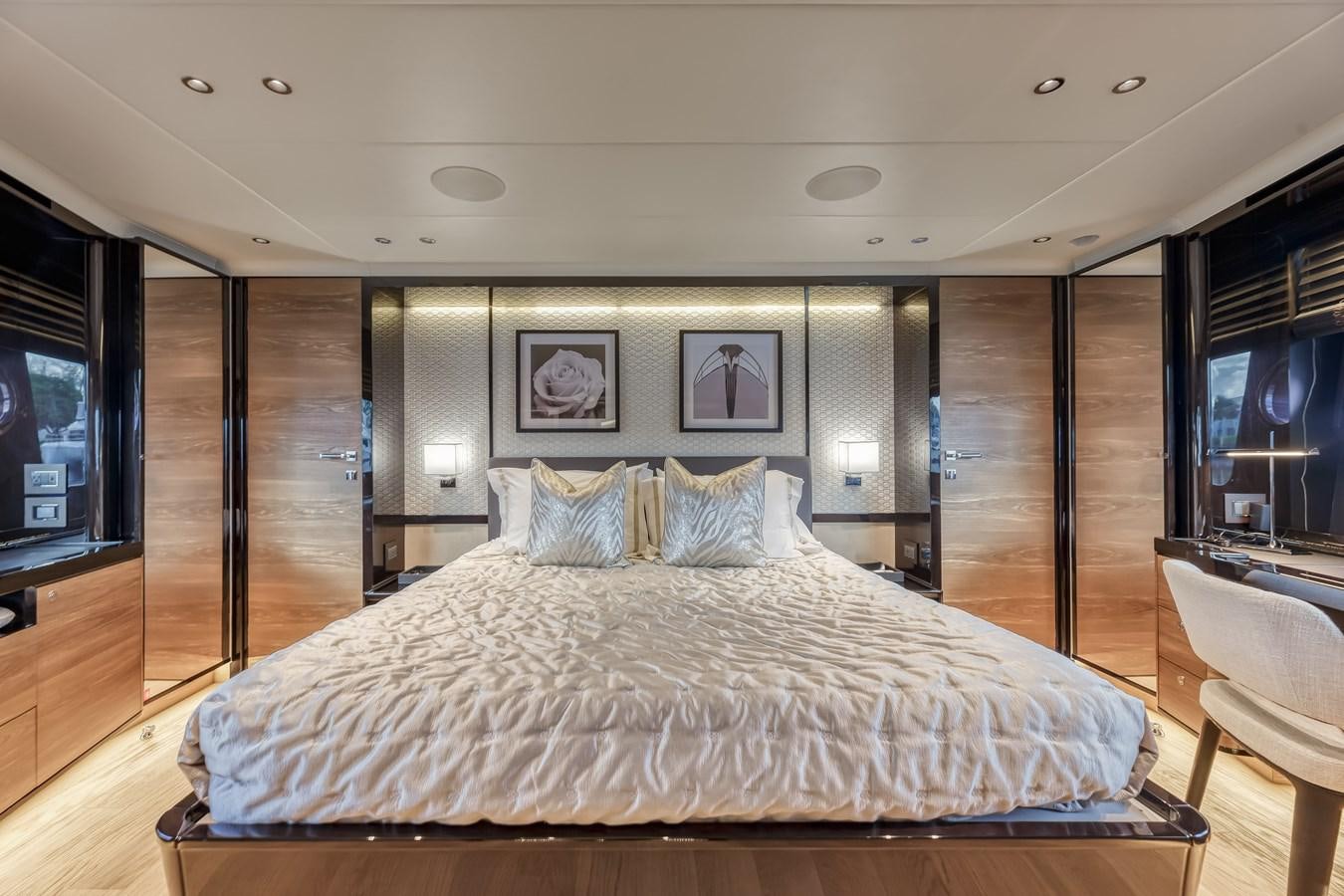 a large bed in a room aboard AQUARIUS Yacht for Sale