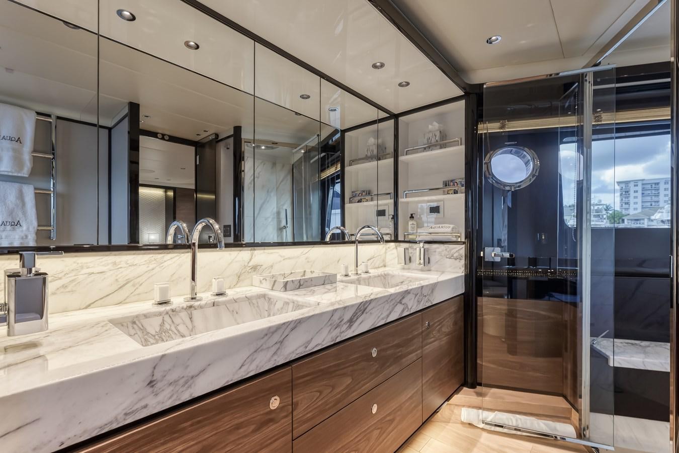 a large bathroom with a large countertop aboard AQUARIUS Yacht for Sale